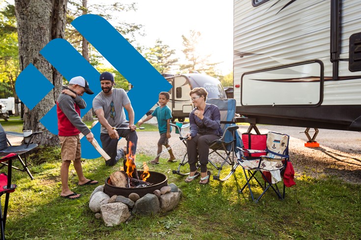 miniature figurines camping and fishing atop a bird bath