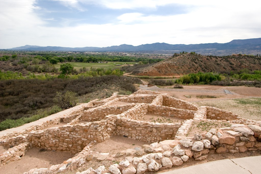 Ancient rock walls on a hillside at Tuzigoot National Monument.